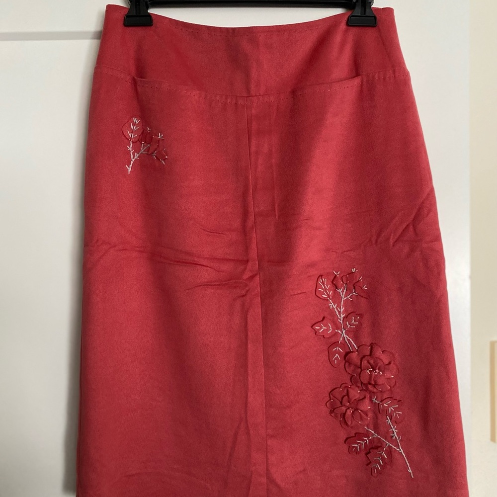 Below knee skirt, unique suede-like synthetic fabric.